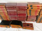 many books stacked on top of each other on a table