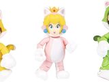 three stuffed animals dressed in costumes of different colors and sizes