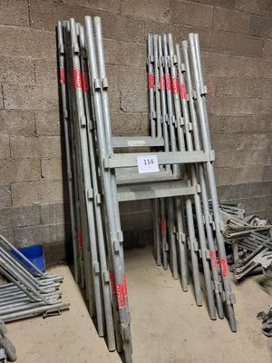 a lot of metal pipes stacked on top of each other