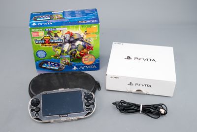 Console de jeux Nintendo Wii avec deux manettes et un coffret de jeux