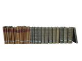 a lot of books that are stacked on top of each other