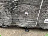 many rolls of wire wrapped in plastic on a pallet