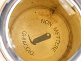 a close up view of a glass of wine with a label on it