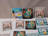 an assortment of children ' s books and cards on a table