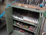 a workbench with many tools on it in a workshop