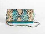 a snake skin clutch bag with chain strap and chain closure