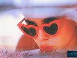 a picture of a woman wearing sunglasses and a hat