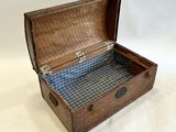 a wooden box with a plaid lining inside of it