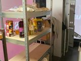 many shelves that have food on them in a room
