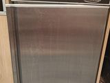 stainless steel dishwasher in a kitchen next to a coffee maker