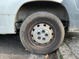a flat tire on the side of a truck