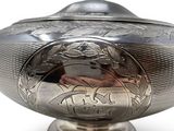 an antique silver bowl with a lid on a white background