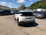 many cars parked in a parking lot in a lot