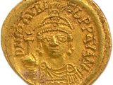 une pièce d'or portant l'image d'un homme