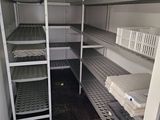 a small room with shelves and shelves in it