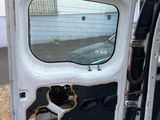 a white van door with a hole in it