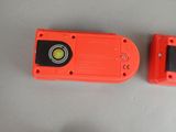 two orange plastic cameras sitting on a table