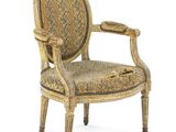 an image of a chair with a floral upholstered back and arms