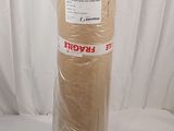 a roll of brown paper wrapped in plastic on a white background