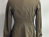 an image of a military jacket on a mannequin stand