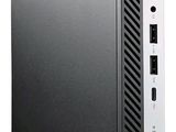 un petit ordinateur noir sur lequel est posé un clavier blanc