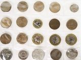a lot of coins in a plastic bag on the table