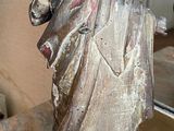 a statue of a man that is sitting on a table