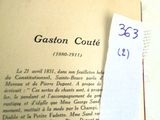 a close up of an open book with a piece of paper on top of it