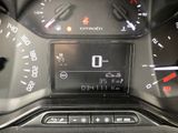 a close up of a car dashboard with a clock on it