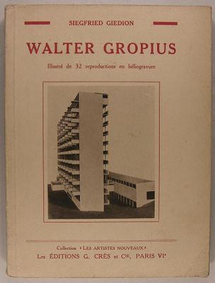 an old book with a picture of a tall building on the cover