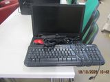 a laptop computer sitting on top of a white table