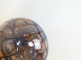 a glass ball that is sitting on a table