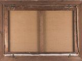 an old wooden frame with a cork board in the middle of it