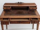 a wooden desk with two drawers underneath it