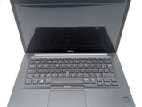 dell laptop computer with keyboard and mouse sitting on a white surface