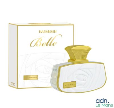un flacon de parfum blanc à côté d'une boîte de parfum
