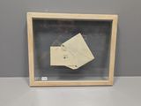 an image of a picture of a piece of paper in a wooden frame