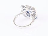a close up of a ring with a large blue stone in it