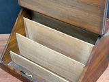 an image of a wooden box with three compartments on a table
