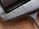 an old gun that is sitting on top of a table