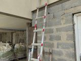a ladder leaning up against a wall next to a building