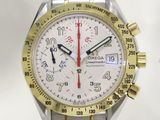 a silver and gold watch with a red second hand