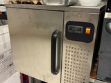 an image of a kitchen with a microwave and a pot on top of it