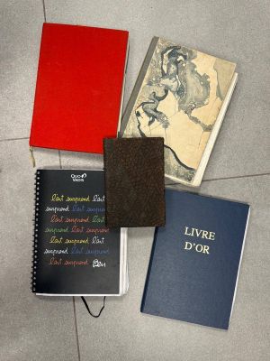 several books are lined up on the floor next to each other
