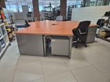 a desk with a chair in the middle of a room