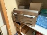 many boxes and boxes on the shelves in the closet