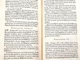a book open on a table with a black background