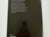 the back cover of a book on a table with a white background