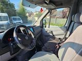 the interior of a white van with the driver ' s seat up