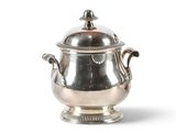 a silver cup with a lid on a white background